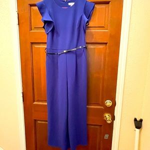 Worn only twice so it is like new.  Zipper back.